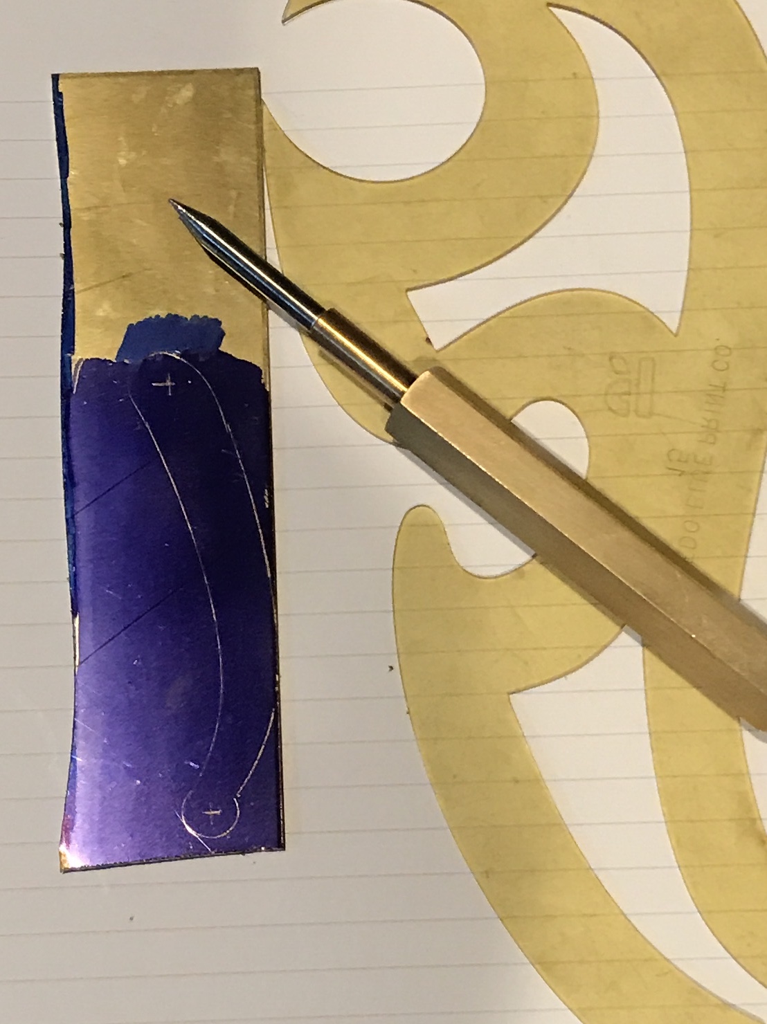 Handle marked out on the inked brass